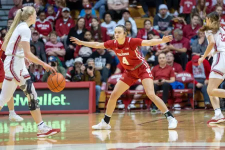 Lily Krahn holds her arms out wide while playing defense.