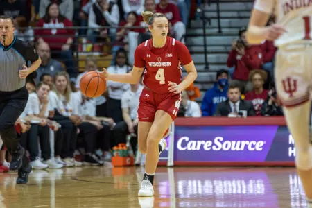 Lily Krahn dribbles the basketball up the floor.