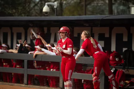 Molly Schlosser clapping for Badger teammates