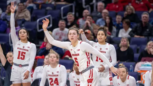 Julie Pospisilova watches the basketball after shooting.