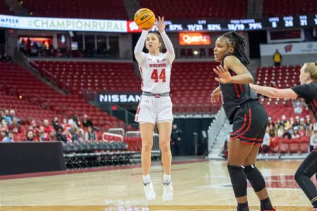 Mary Ferrito shoots the basketball from the top of the key.