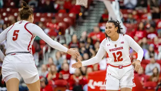 Avery LaBarbera gives Julie Pospisilova a high five.