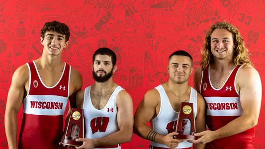 Wisconsin wrestling Dean Hamiti, Eric Barnett, Austin Gomez and Trent Hillger, 2022-23 with NCAA All-America trophies