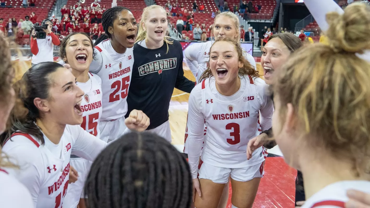 The Wisconsin women's basketball team celebrating after beating No. 12 Michigan