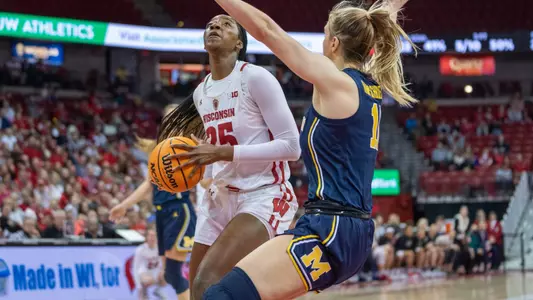 Serah Williams going for a layup against a Michigan defender