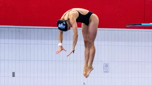 Kit Greenberg competes in a diving event