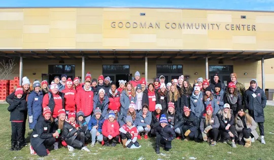 Wisconsin staff and student-athletes together for Badgers Give Back event at the Goodman Community Center