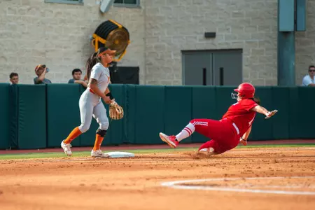Kayla Konwent slides into third base at Texas