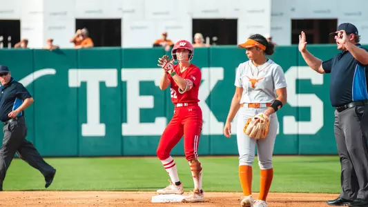 Peyton Bannon clapping at second after hitting a double