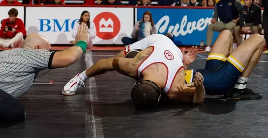 Austin Gomez pins his opponent