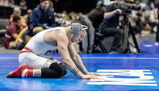 Austin Gomez on the NCAA wrestling mat at the 2022 NCAA Wrestling Championships in Detroit, Michigan during Session 4.