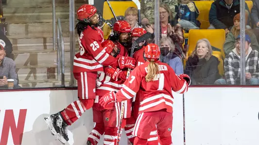 Wisconsin women's hockey celebrates a goal against Minnesota at the 2023 Frozen Four semifinal