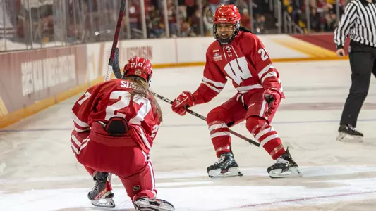 Women's hockey Kirsten Simms (27) celebrates a goal with teammate Chayla Edwards (25) during the 2023 NCAA Women's Hockey Championship game on Sunday, March 19, 2023 in Duluth, Minnesota