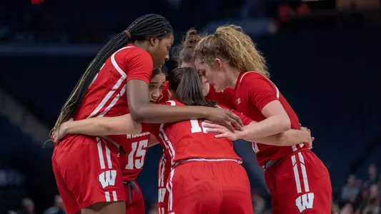 Serah Williams, Maty Wilke and Avery LaBarbera huddle in game vs. Purdue at 2023 B1G Tournament in Minneapolis.