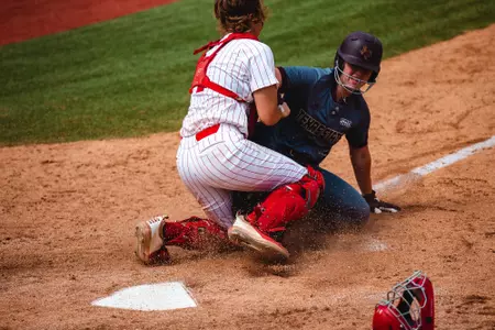 Christaana Angelopulos getting the out at home as catcher