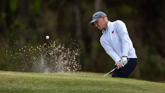 Daniel Aas hits a ball out of the bunker at the Schenkel Invitational on March 17-19