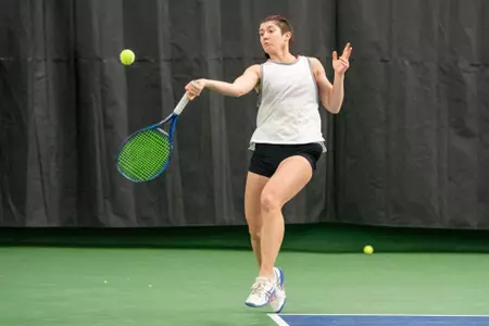 Taylor Cataldi returns a ball during a match
