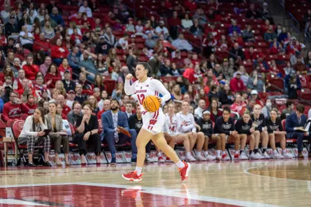 Avery LaBarbera dribbles the basketball up the court.