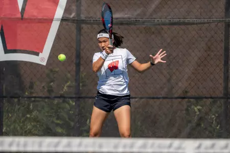 Charmaine Seah returns the ball during a match