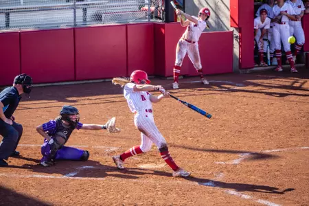Katie Keller swinging the bat at the plate