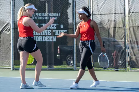 Ariel Johnson and Maria Sholokhova celebrate against Illinois