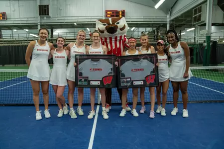 The Wisconsin women's tennis team celebrates Senior Night