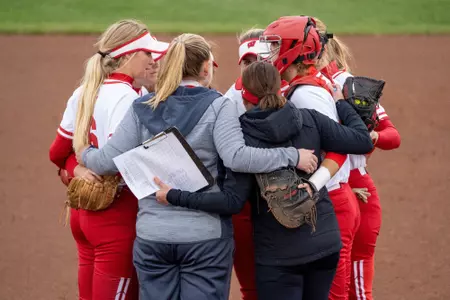 The Badger softball team huddled up on the mound
