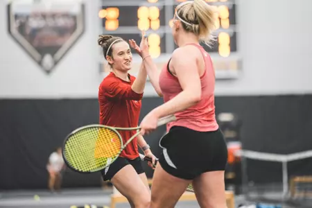 Ava Markham and Maria Sholokhova celebrate against Northwestern