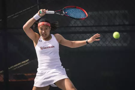 Charmaine Seah returns the ball during her match against Michigan