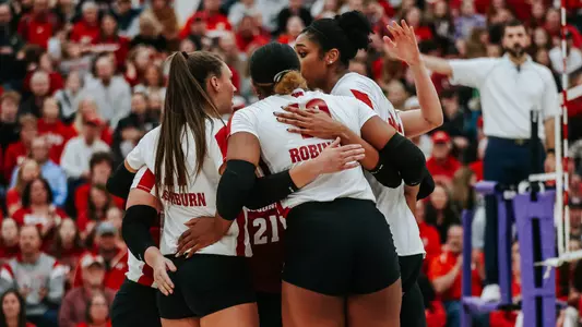 The Badgers celebrate a point on the court