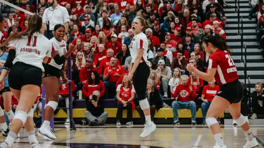 The Badgers celebrate a point on the court.