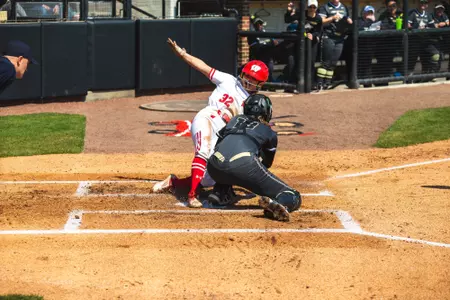 Marytherese Nevin scores on a squeeze bunt against Purdue