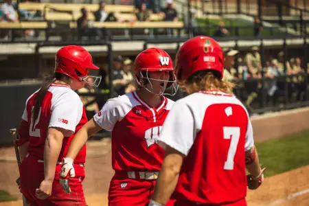 Badgers celebrating scoring run at home plate