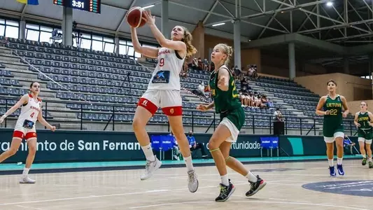 Ana Guillen midair attempting a layup