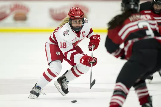 Wisconsin Badgers Brianna Decker (18) handles the puck during an NCAA women's college WCHA Conference playoff hockey game against the St. Cloud State Huskies in Camp Randall Stadium on Saturday, March 2, 2013, in Madison, Wis. The Badgers won 4-1.