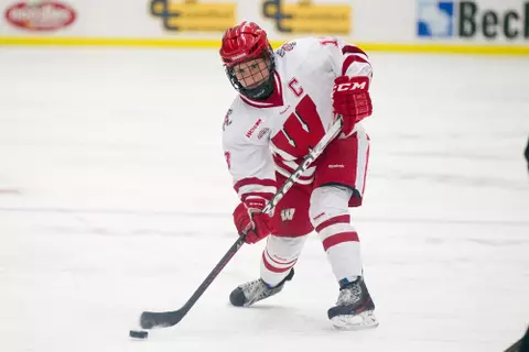Wisconsin Badgers Brianna Decker (18) handles the puck during an NCAA women's college WCHA Conference playoff hockey game against the St. Cloud State Huskies Saturday, March 2, 2013, in Madison, Wis. The Badgers won 4-1.