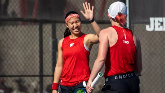 Charmaine Seah above to high five Taylor Cataldi