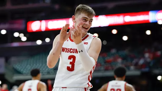 Connor Essegian claps during a game against Stanford at American Family Field