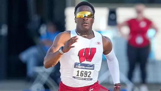 Lawrence Johnson competes in the 100 meters