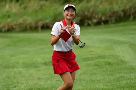 Vanessa Ho, Wisconsin women's golf, holds her hands up in a "W" at the 2022 Badger Invitational at University Ridge Golf Course in September 2022 in Madison, Wisconsin.