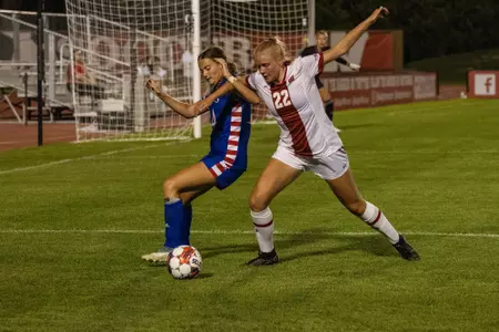 Sarah Rosenbaum battles a Kansas defender for the ball