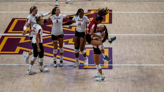 Gulce Guctekin leaps into Izzy Ashburn's arms after an ace against TCU