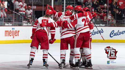 Goal celebration with 75th season logo
