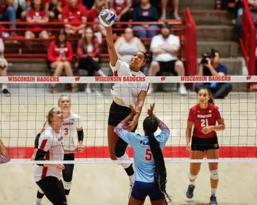Gabby McCaa hits the ball at the UW Field House
