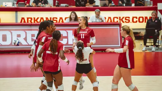 GG celebrates with team and picks up Izzy Ashburn