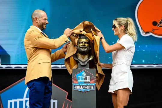 Joe Thomas and wife Annie Thomas unveil his NFL Hall of Fame bust at the 2023 ceremony