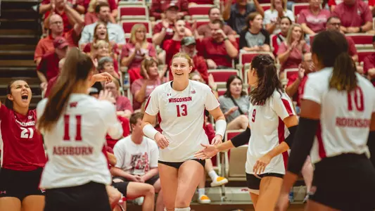 Sarah Franklin cheers with her team