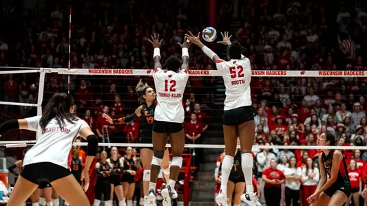 Carter Booth and Temi Thomas-Ailara block the ball