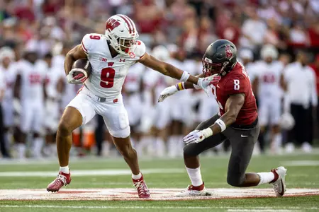 Wisconsin Badgers wide receiver Bryson Green (9) carries the ball during an NCAA college football game against the Washington State Cougars, Saturday, Sept. 9, 2023, in Pullman, Wash. The Cougars won 31-22. (Photo by David Stluka/Wisconsin Athletic Communications)