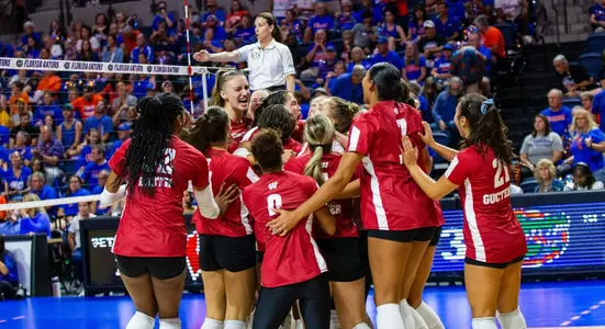The Wisconsin volleyball team celebrates after beating Florida in five sets.